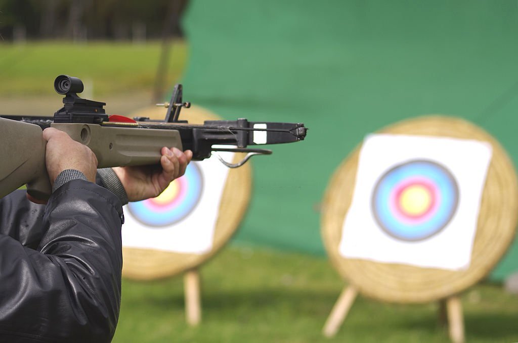 aiming crossbow at targets